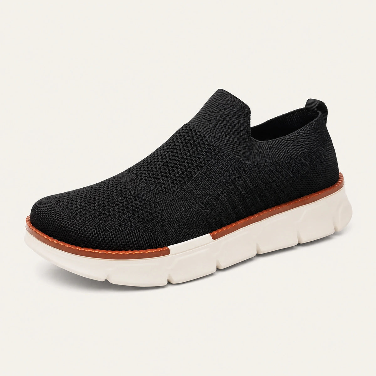 Black XE5813 knit slip-on shoe with a heel loop, brown welt and cream segmented sole.
