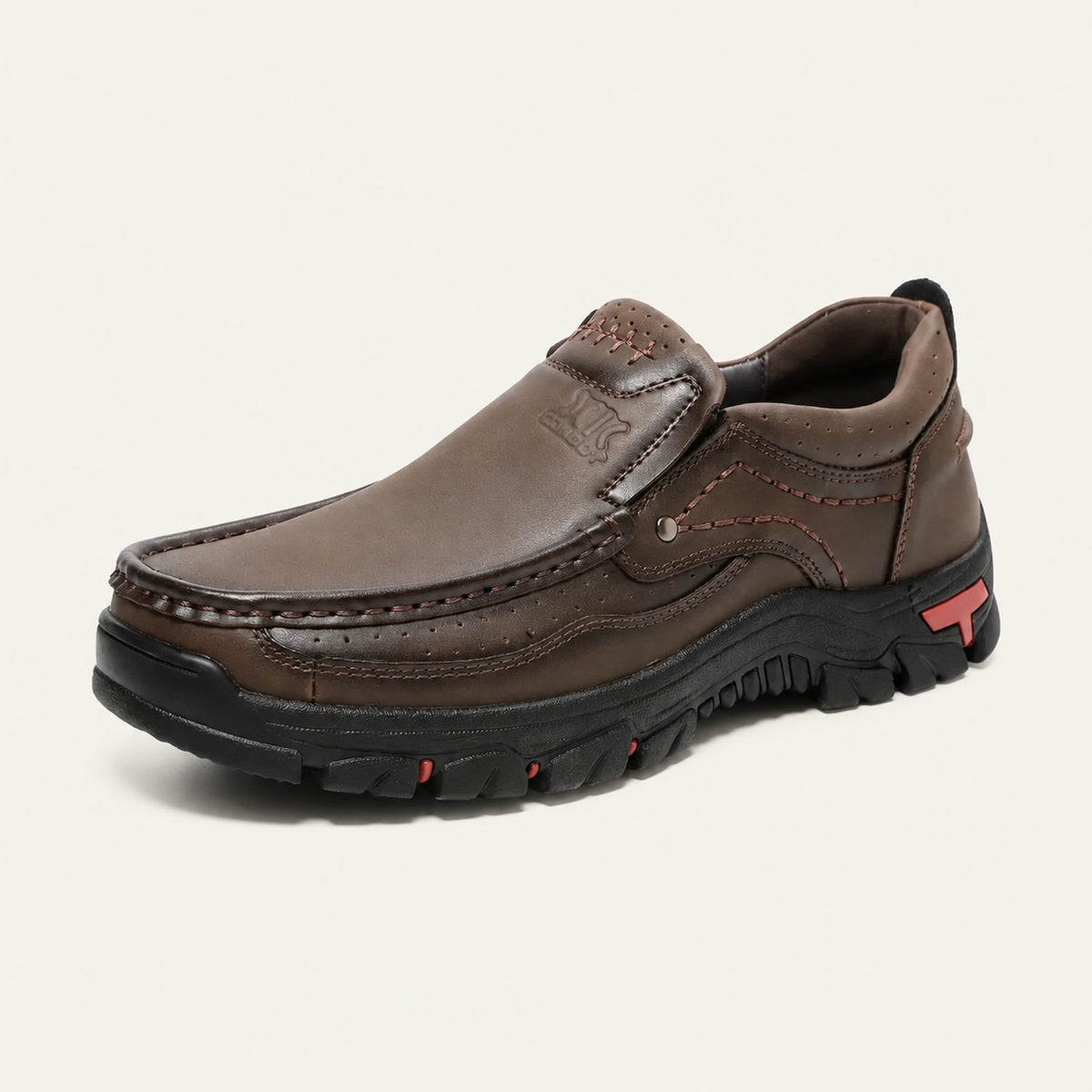 Dark brown XK8815 moc-toe slip-on shoe with visible stitching and a textured outsole.