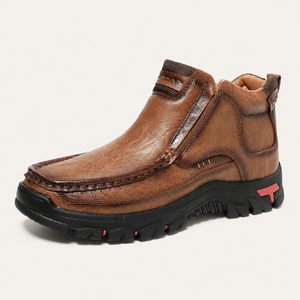 Light brown 33238 moc-toe slip-on ankle boot on a warm off-white background.