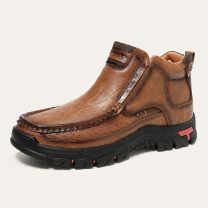 Light brown 33238 moc-toe slip-on ankle boot on a warm off-white background.