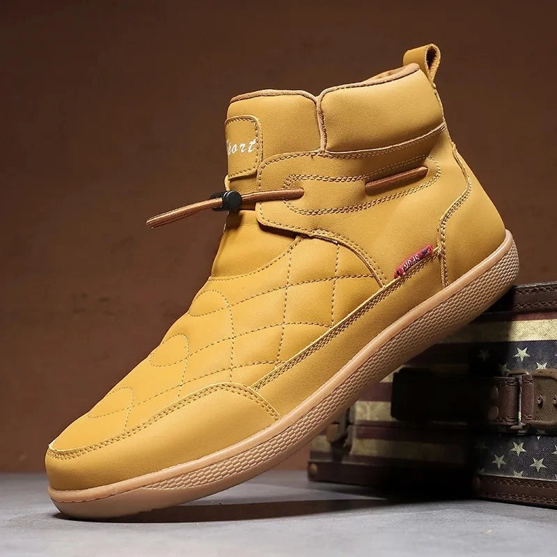 Tan 95856 quilted ankle boot displayed beside a vintage storage case.